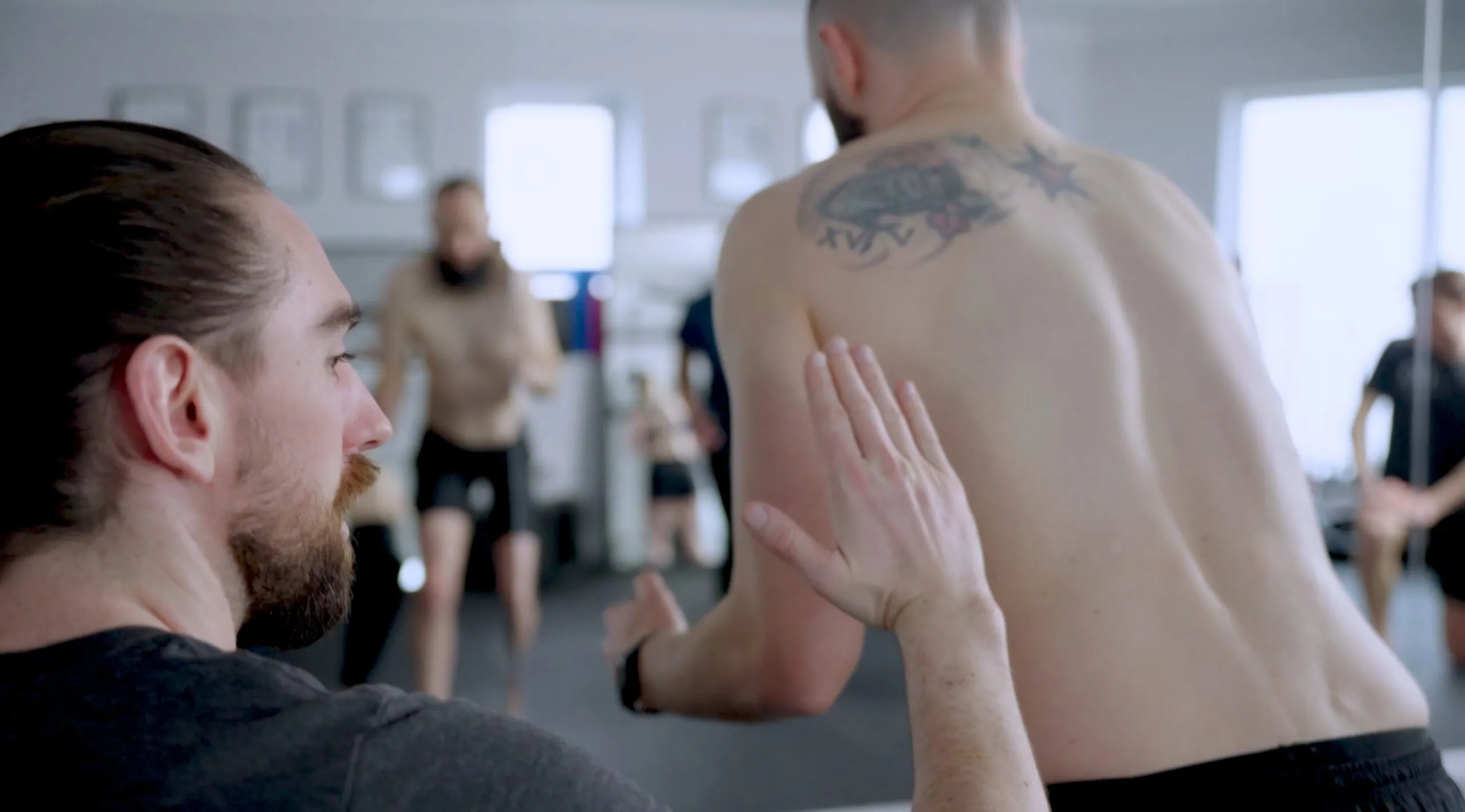A practitioner checking a client's posture