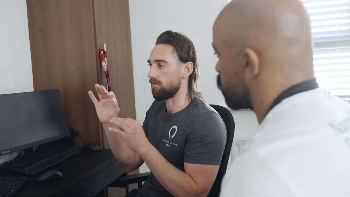 A practitioner talking a client through his assessment