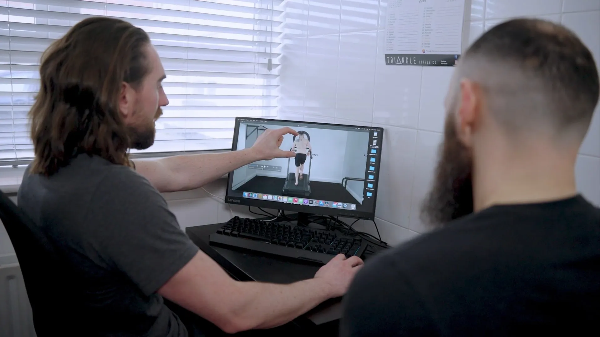 A practitioner reviewing a postural assessment with a client